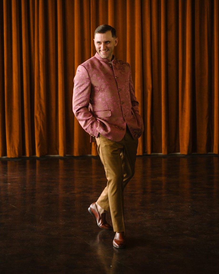 DJ Dayve in a pink brocade jacket